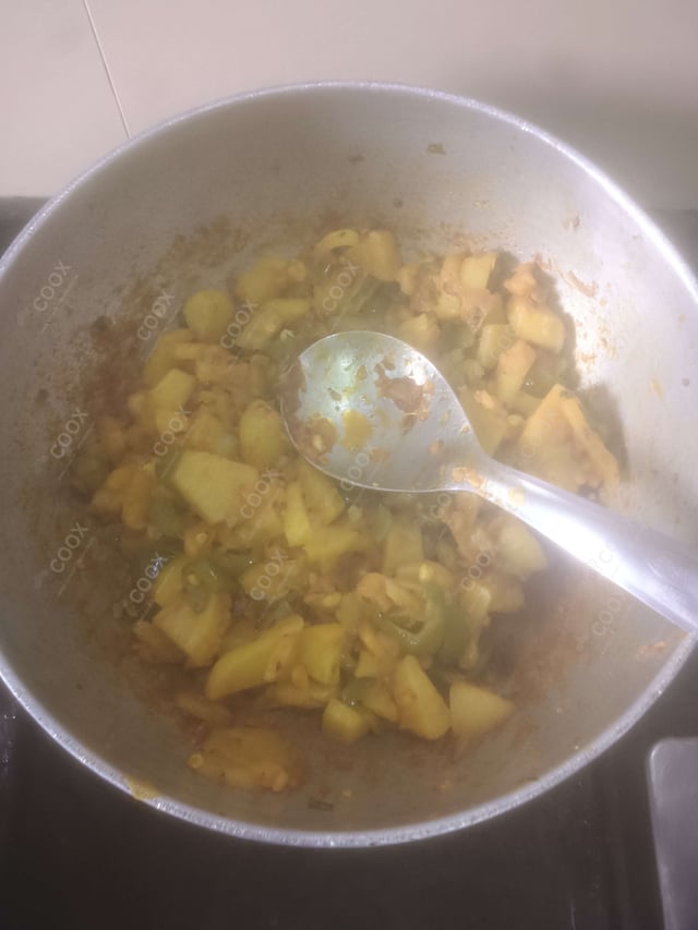 Tasty Aloo Shimla Mirch cooked by COOX chefs cooks during occasions parties events at home