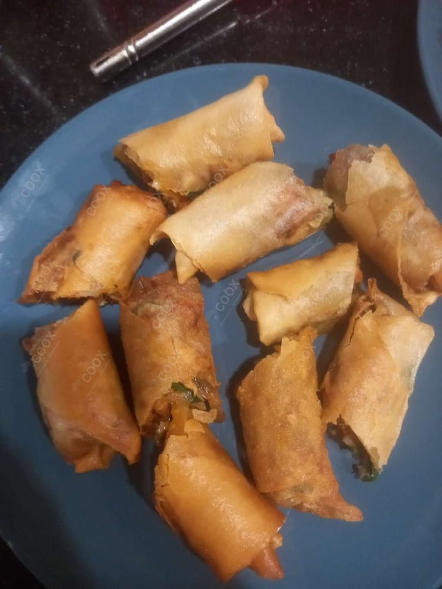 Delicious Chicken Spring Rolls prepared by COOX