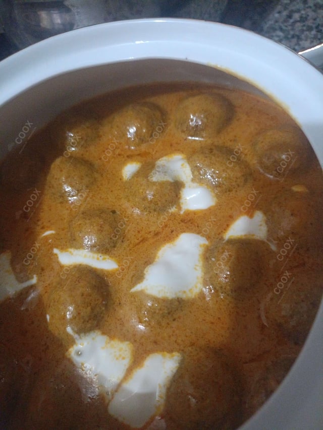 Delicious Malai Kofta (Orange Gravy) prepared by COOX