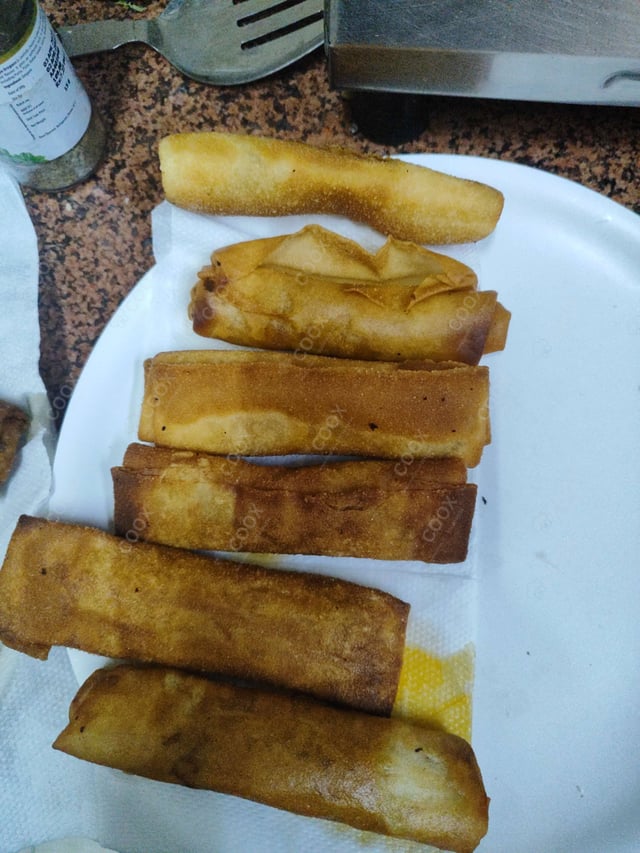 Delicious Veg Spring Rolls prepared by COOX