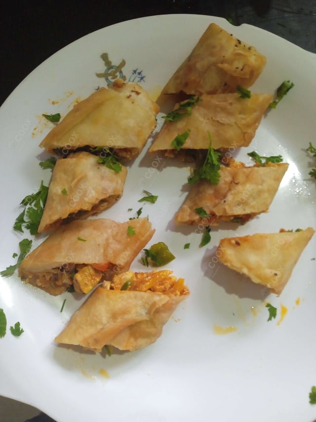 Delicious Chicken Spring Rolls prepared by COOX