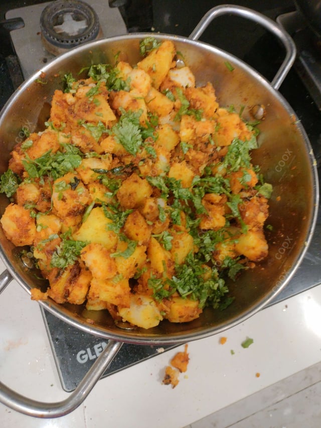 Delicious Jeera Aloo prepared by COOX