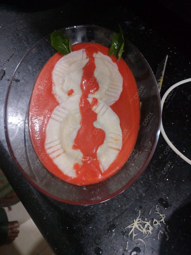 Delicious Ravioli in Pink Sauce prepared by COOX