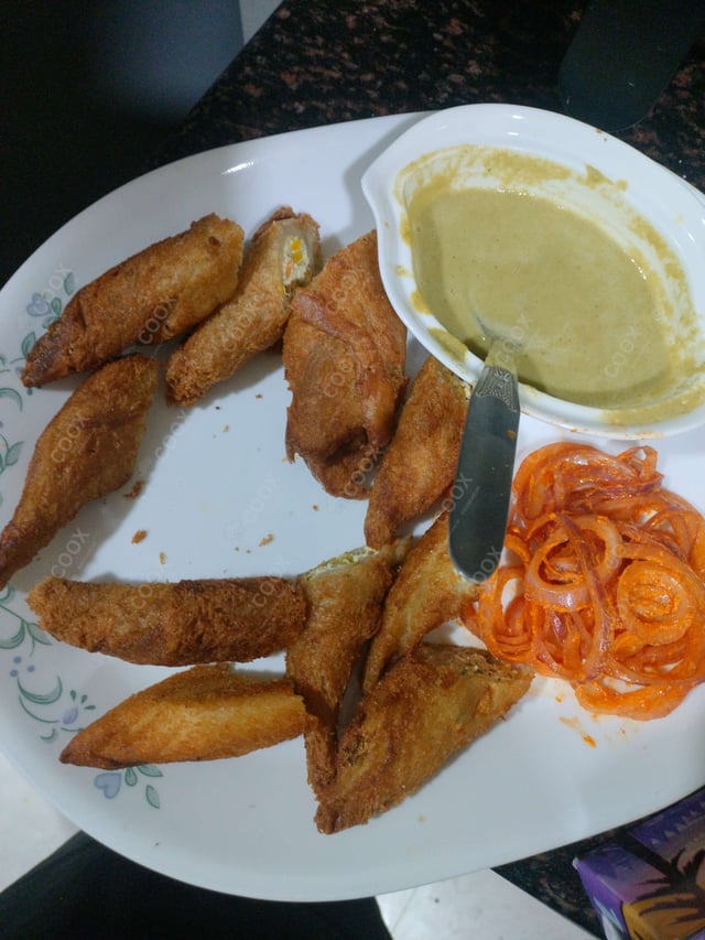 Delicious Dahi ke Sholey prepared by COOX