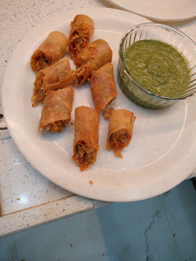 Delicious Veg Spring Rolls prepared by COOX
