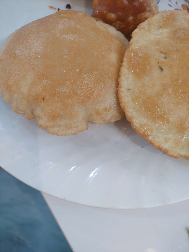 Delicious Pooris & Bedmis prepared by COOX