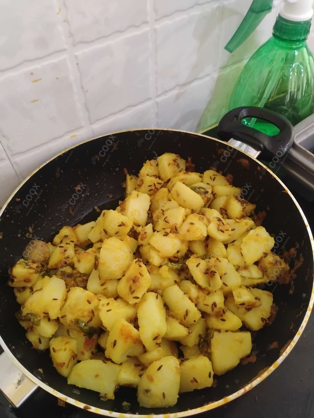 Delicious Jeera Aloo prepared by COOX