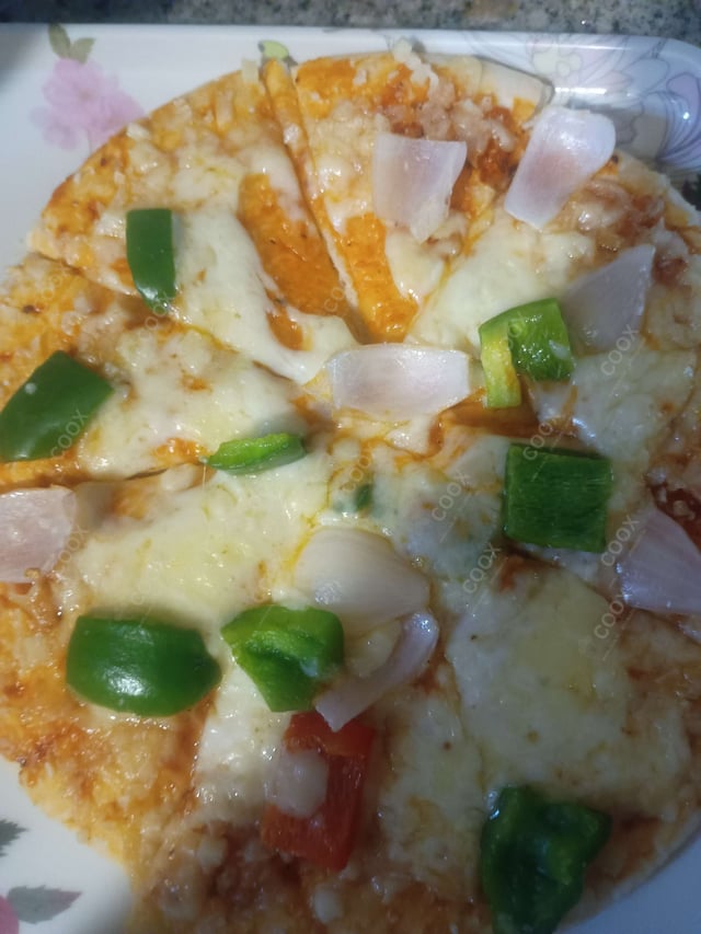 Delicious Veg Pizza prepared by COOX