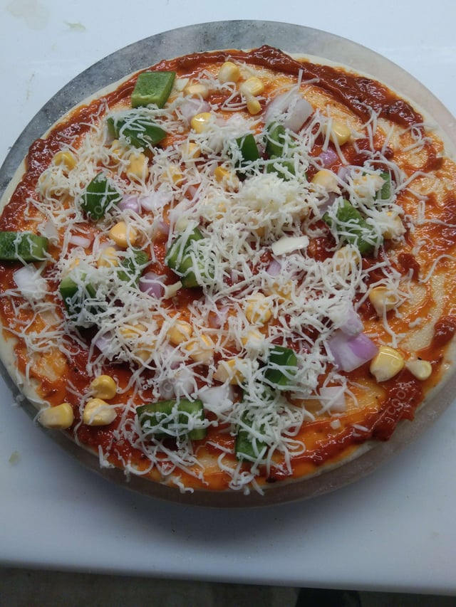 Delicious Veg Pizza prepared by COOX