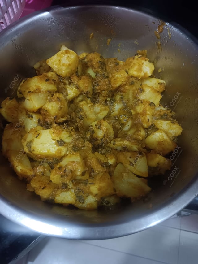 Tasty Aloo Shimla Mirch cooked by COOX chefs cooks during occasions parties events at home