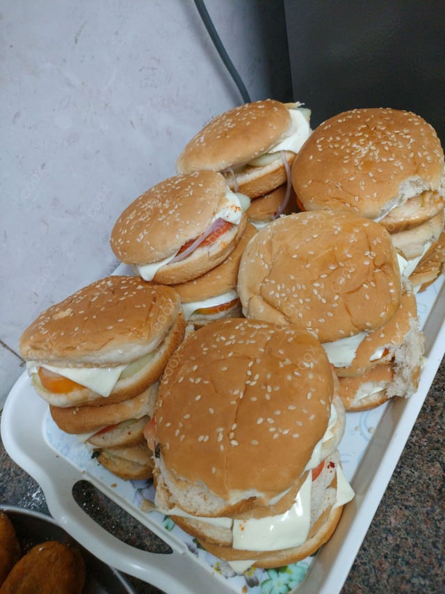 Delicious Mini Veg Burgers prepared by COOX