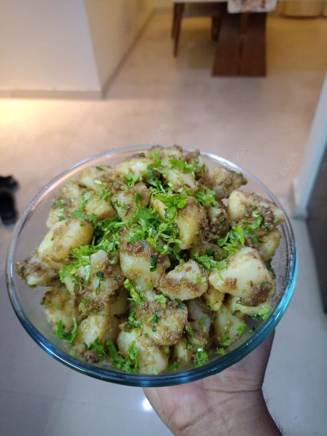 Delicious Jeera Aloo prepared by COOX
