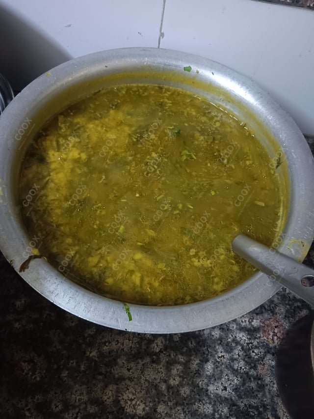 Tasty Palak Dal cooked by COOX chefs cooks during occasions parties events at home