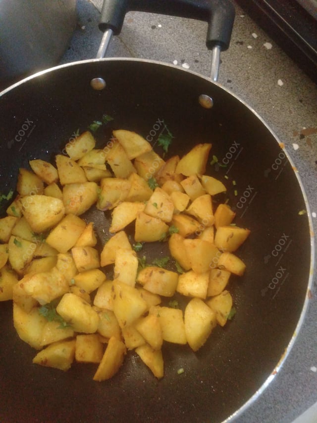 Delicious Jeera Aloo prepared by COOX