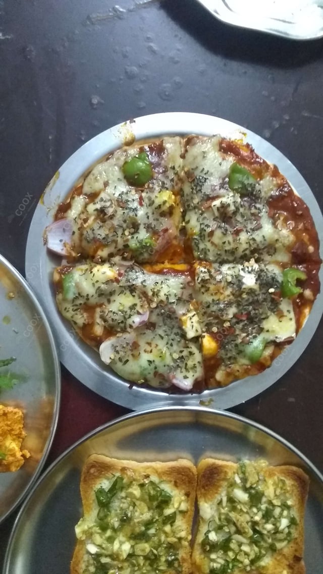 Tasty Veg Pizza cooked by COOX chefs cooks during occasions parties events at home