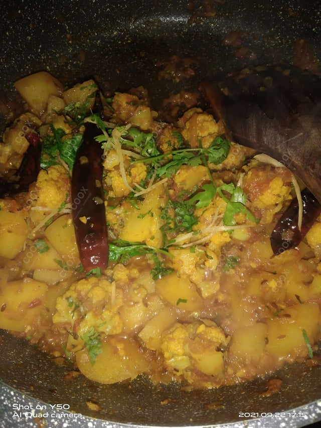 Tasty Aloo Gobhi cooked by COOX chefs cooks during occasions parties events at home