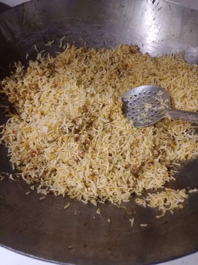 Delicious Schezwan Fried Rice prepared by COOX