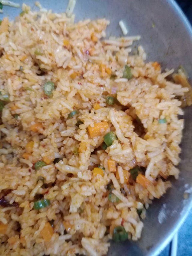 Tasty Schezwan Fried Rice cooked by COOX chefs cooks during occasions parties events at home
