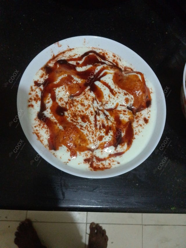 Delicious Dahi Bhalla prepared by COOX