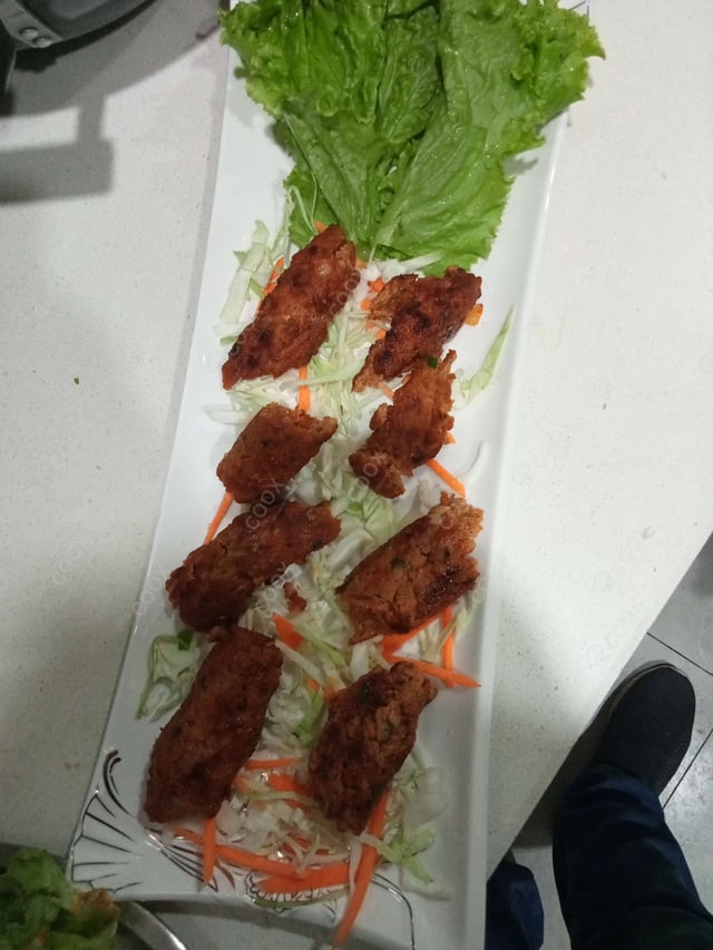 Delicious Mutton Seekh Kebab prepared by COOX