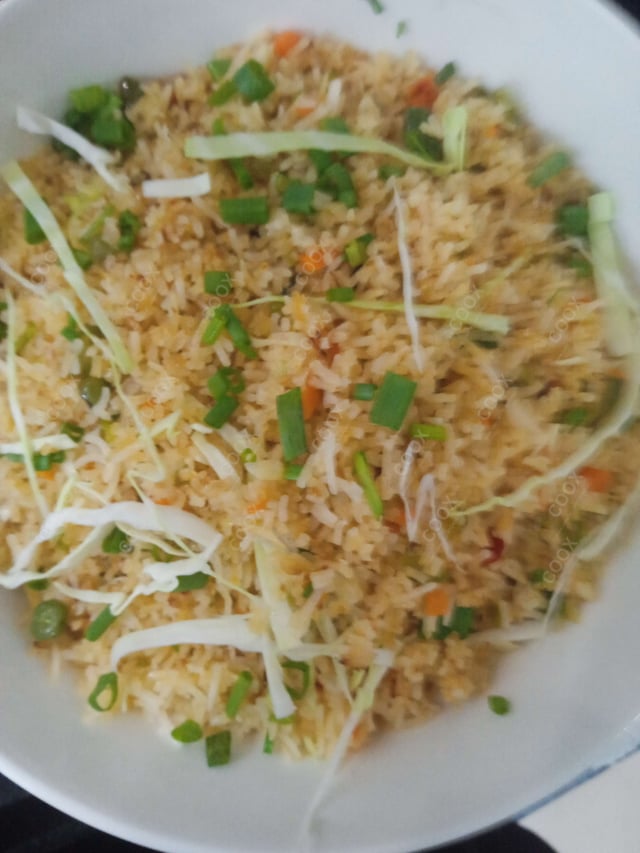 Delicious Schezwan Fried Rice prepared by COOX