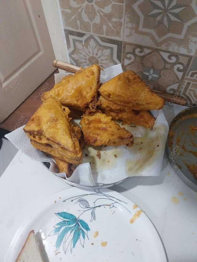 Tasty Bread Pakode cooked by COOX chefs cooks during occasions parties events at home