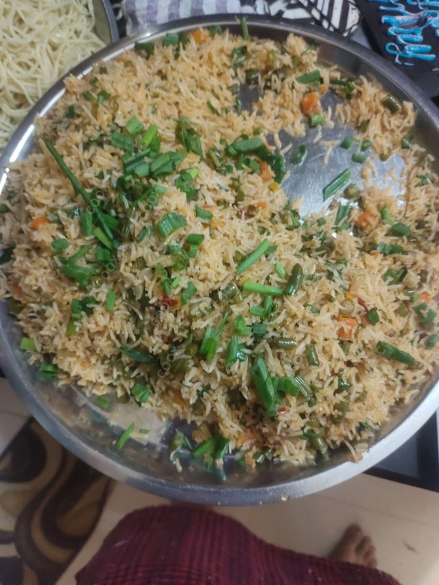 Delicious Schezwan Fried Rice prepared by COOX