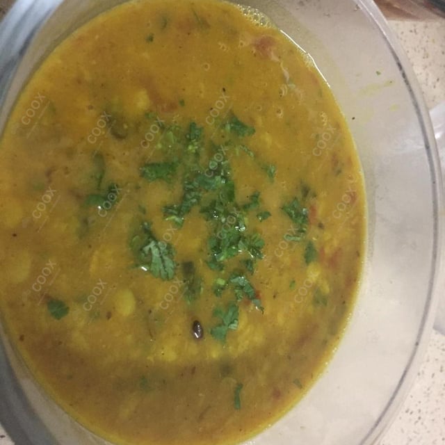 Tasty Dal Tadka cooked by COOX chefs cooks during occasions parties events at home