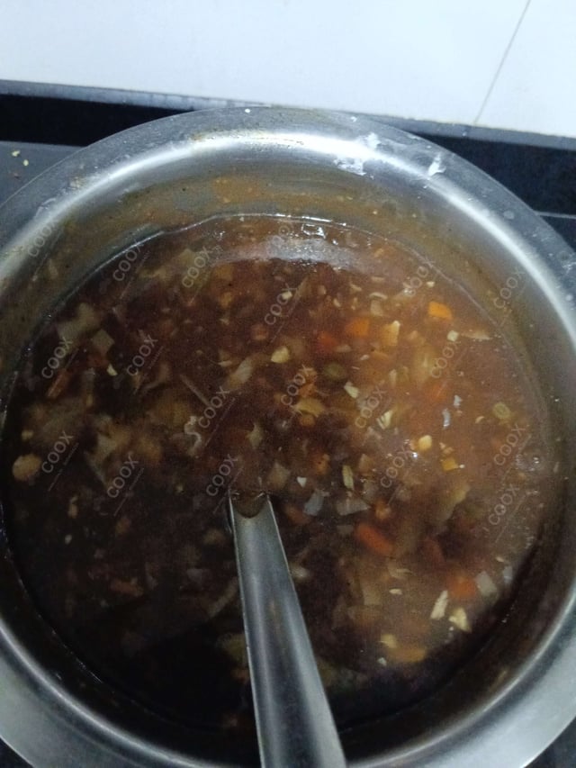 Delicious Vegetable Manchow Soup prepared by COOX