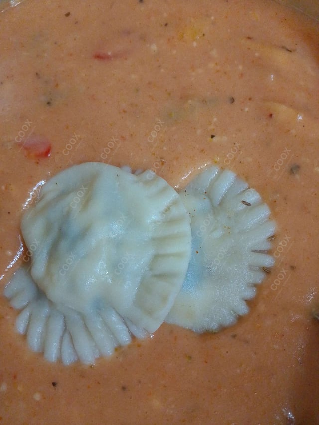 Delicious Ravioli in Pink Sauce prepared by COOX