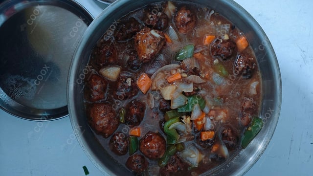 Tasty Chicken Manchurian (Gravy) cooked by COOX chefs cooks during occasions parties events at home