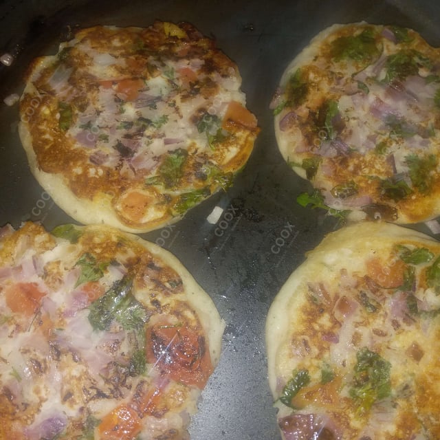 Tasty Mixed Veg Uttappam cooked by COOX chefs cooks during occasions parties events at home