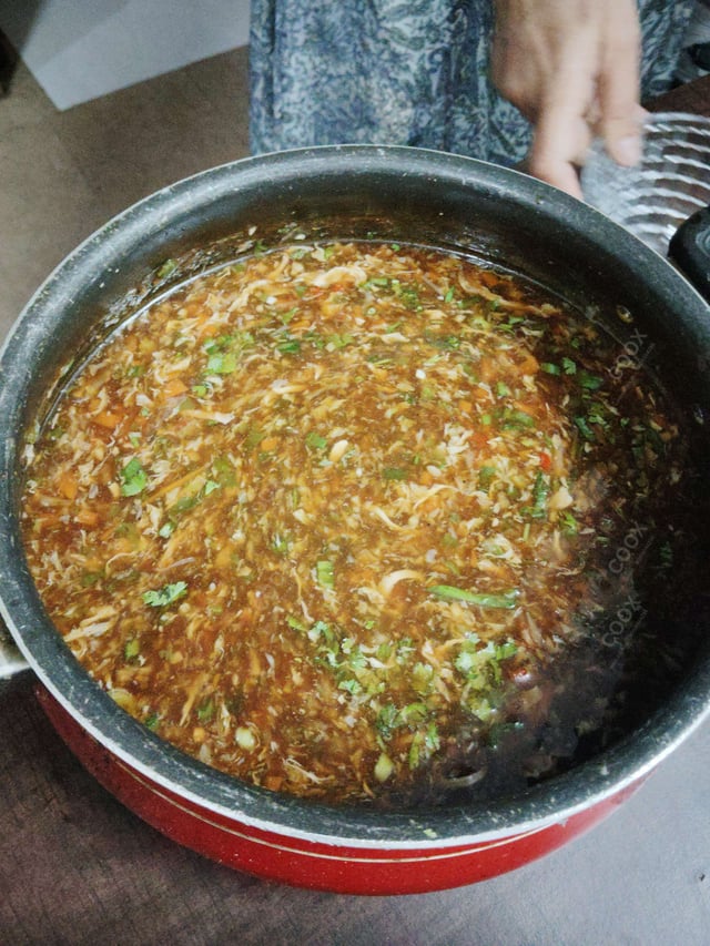 Tasty Chicken Manchow Soup cooked by COOX chefs cooks during occasions parties events at home