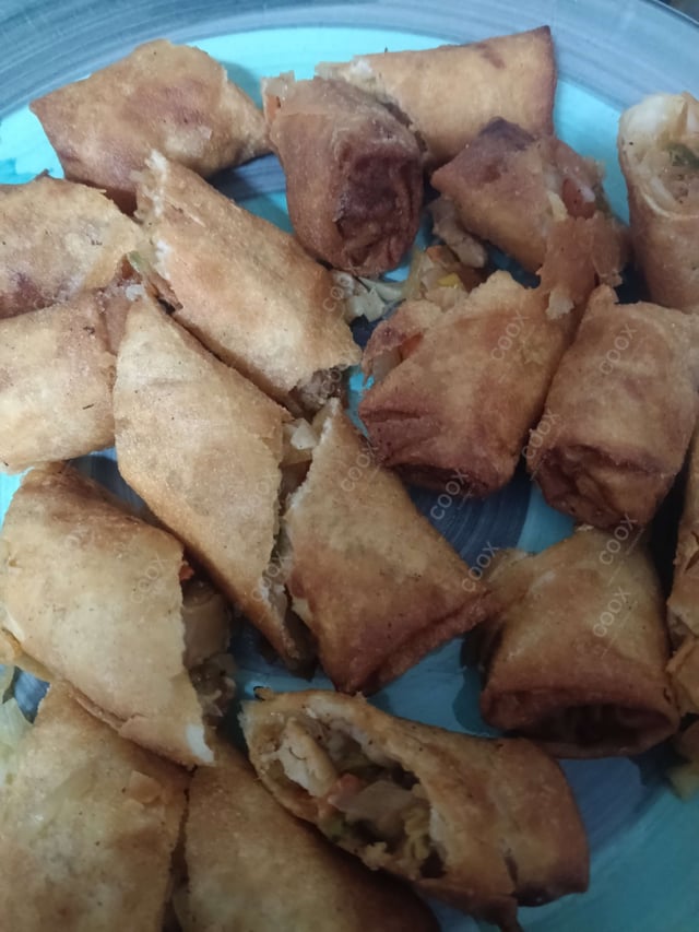 Delicious Chicken Spring Rolls prepared by COOX