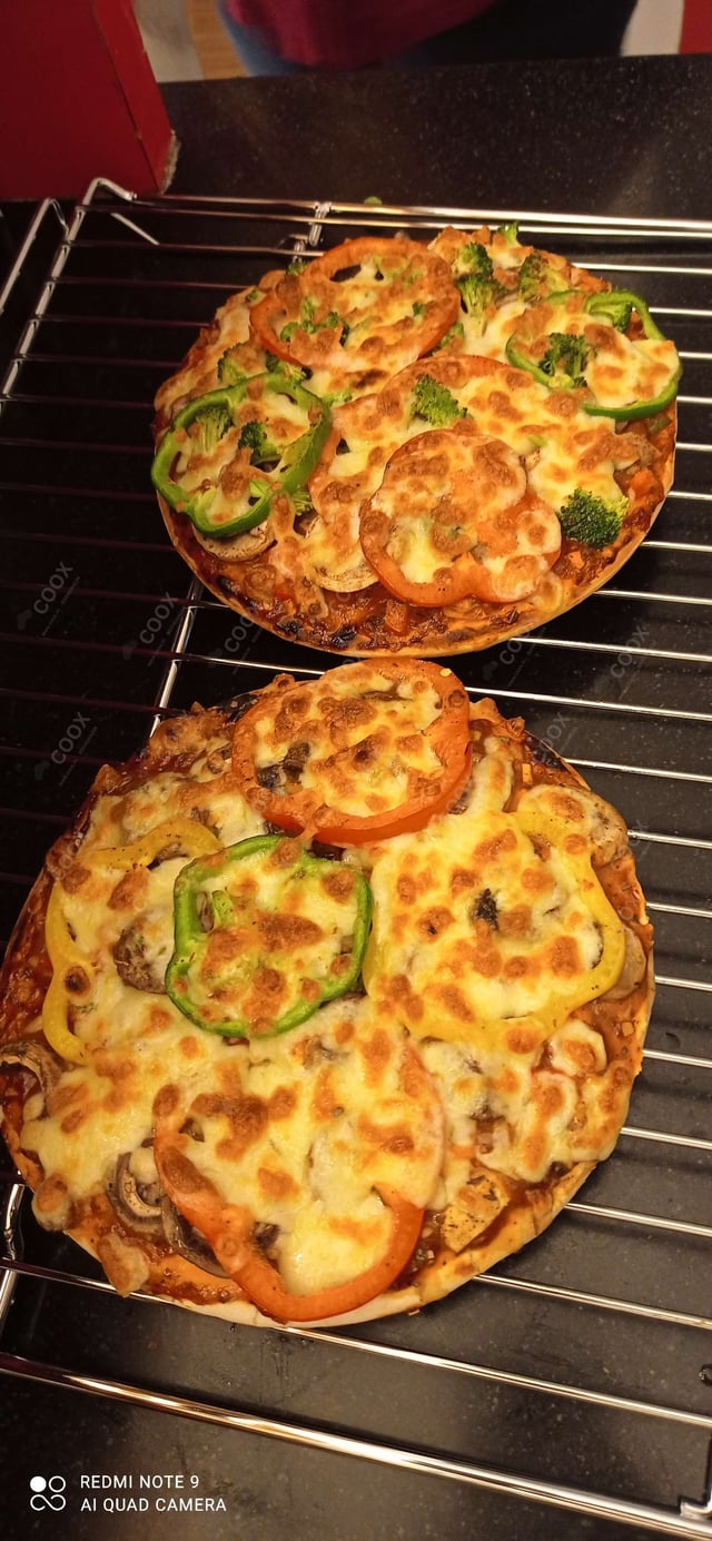 Tasty Veg Pizza cooked by COOX chefs cooks during occasions parties events at home