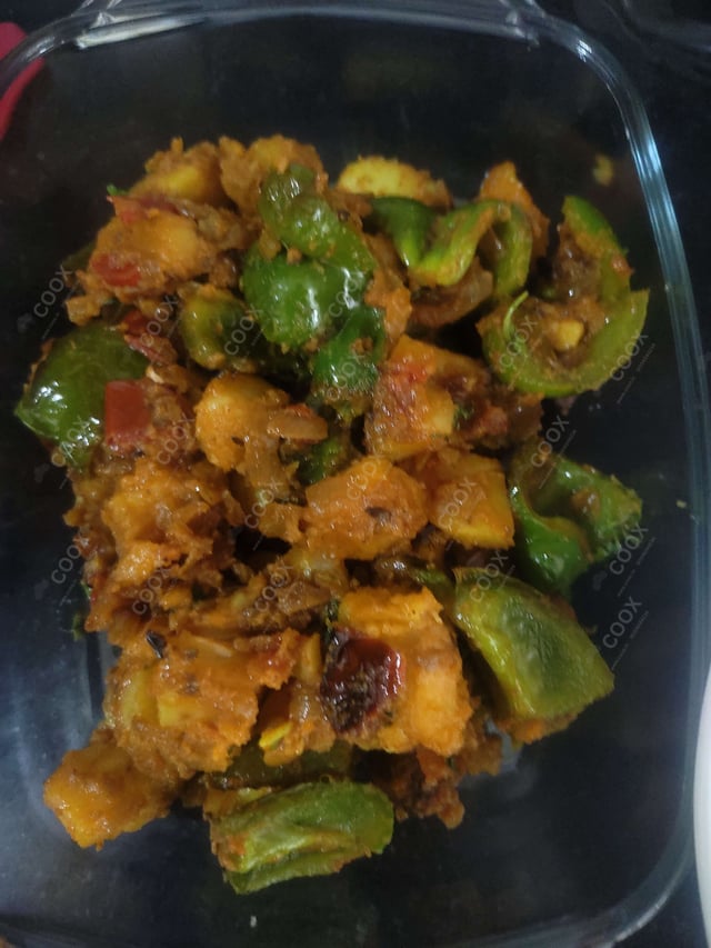 Tasty Aloo Shimla Mirch cooked by COOX chefs cooks during occasions parties events at home