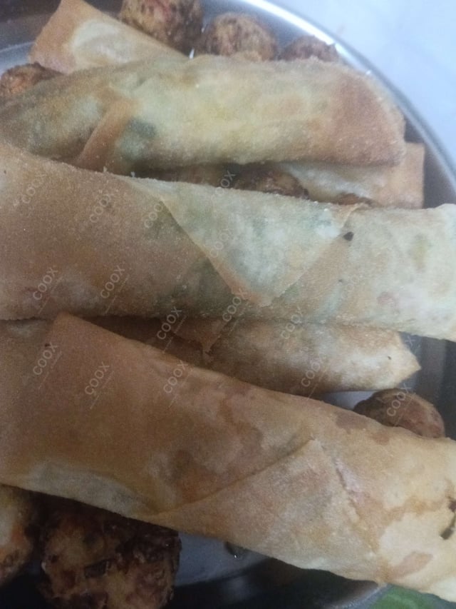 Delicious Veg Spring Rolls prepared by COOX