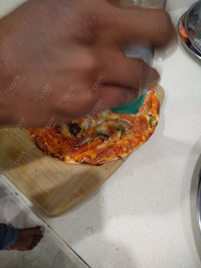 Delicious Veg Pizza prepared by COOX