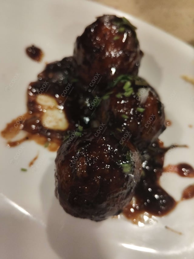 Delicious Veg Manchurian (Dry) prepared by COOX