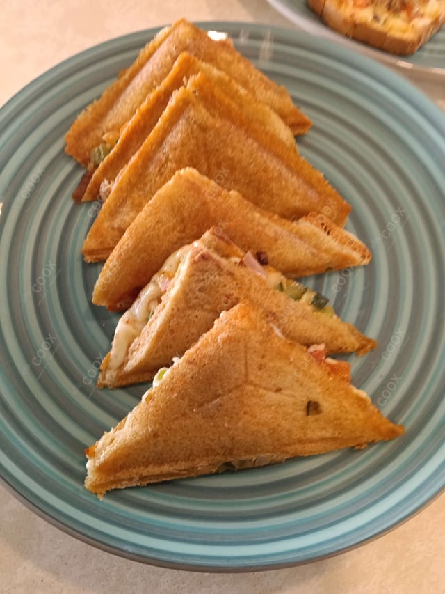 Tasty Grilled Veg Sandwiches cooked by COOX chefs cooks during occasions parties events at home