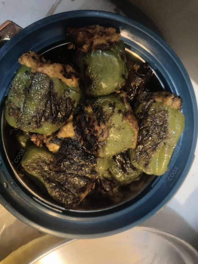 Delicious Bharwa Shimla Mirch prepared by COOX