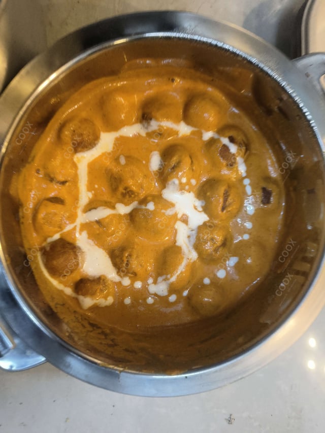Delicious Malai Kofta (Orange Gravy) prepared by COOX