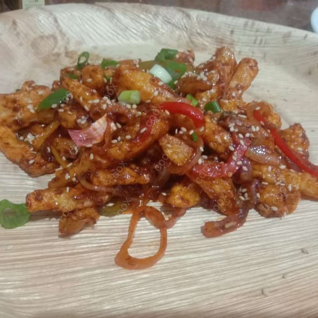 Tasty Honey Chilli Potato cooked by COOX chefs cooks during occasions parties events at home