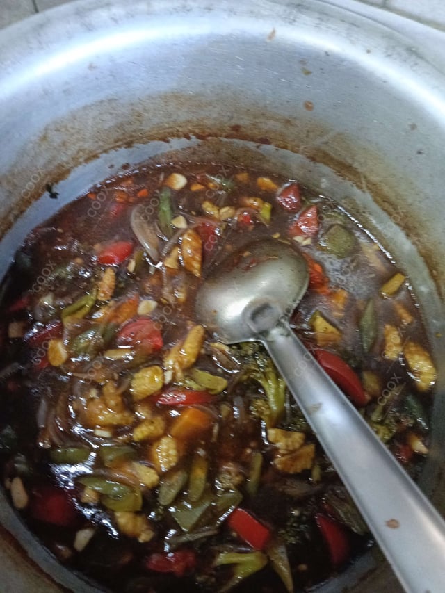 Tasty Mix Veg in Schezwan Sauce cooked by COOX chefs cooks during occasions parties events at home