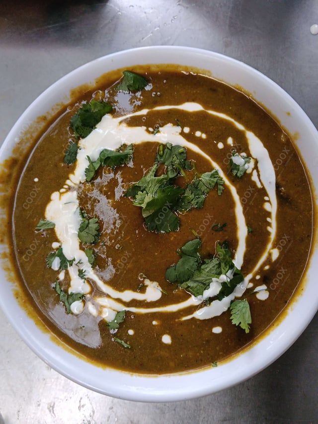 Tasty Palak Dal cooked by COOX chefs cooks during occasions parties events at home