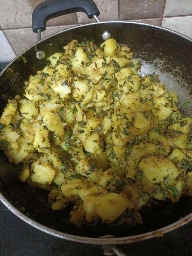 Delicious Jeera Aloo prepared by COOX