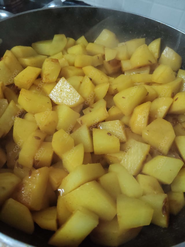 Delicious Jeera Aloo prepared by COOX