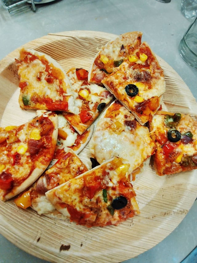 Delicious Veg Pizza prepared by COOX