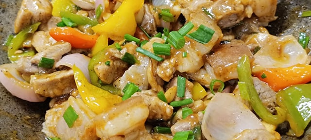 Tasty Chilli Pork with Peppers cooked by COOX chefs cooks during occasions parties events at home