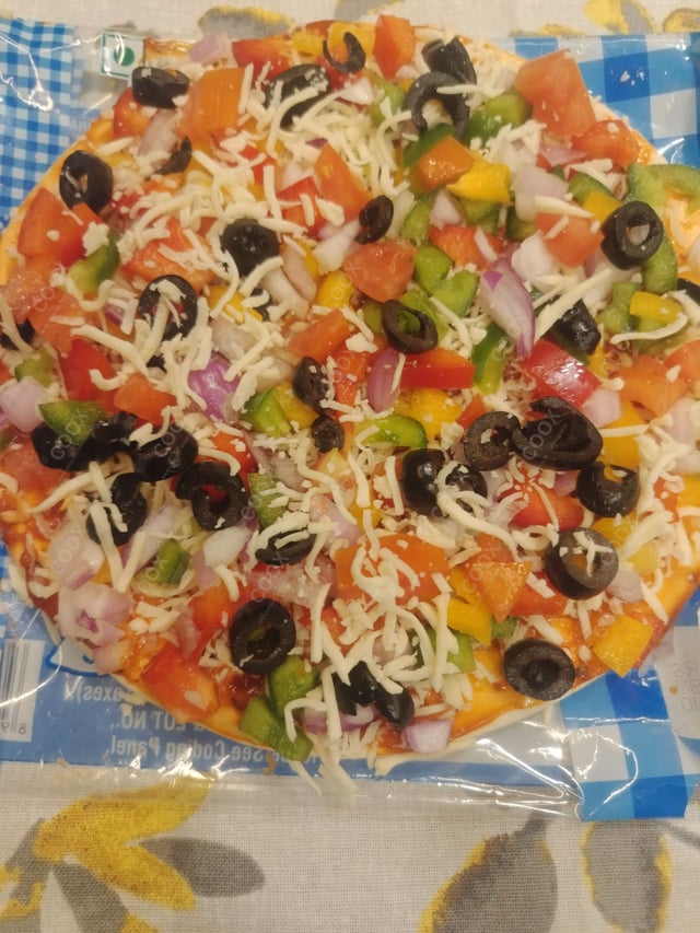 Delicious Veg Pizza prepared by COOX